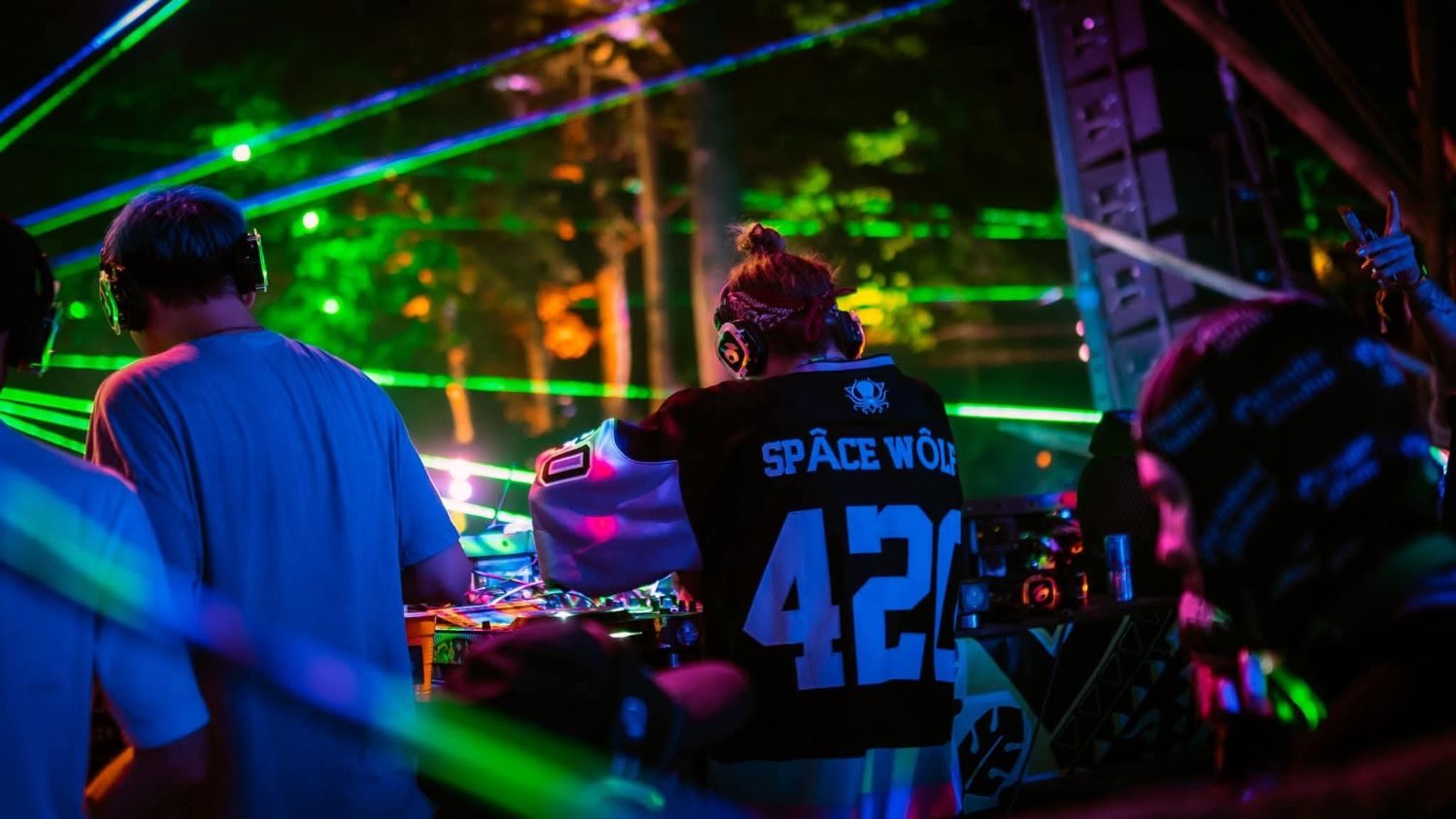 Spacewolf in a Space Wolf 420 jersey playing under laser beams